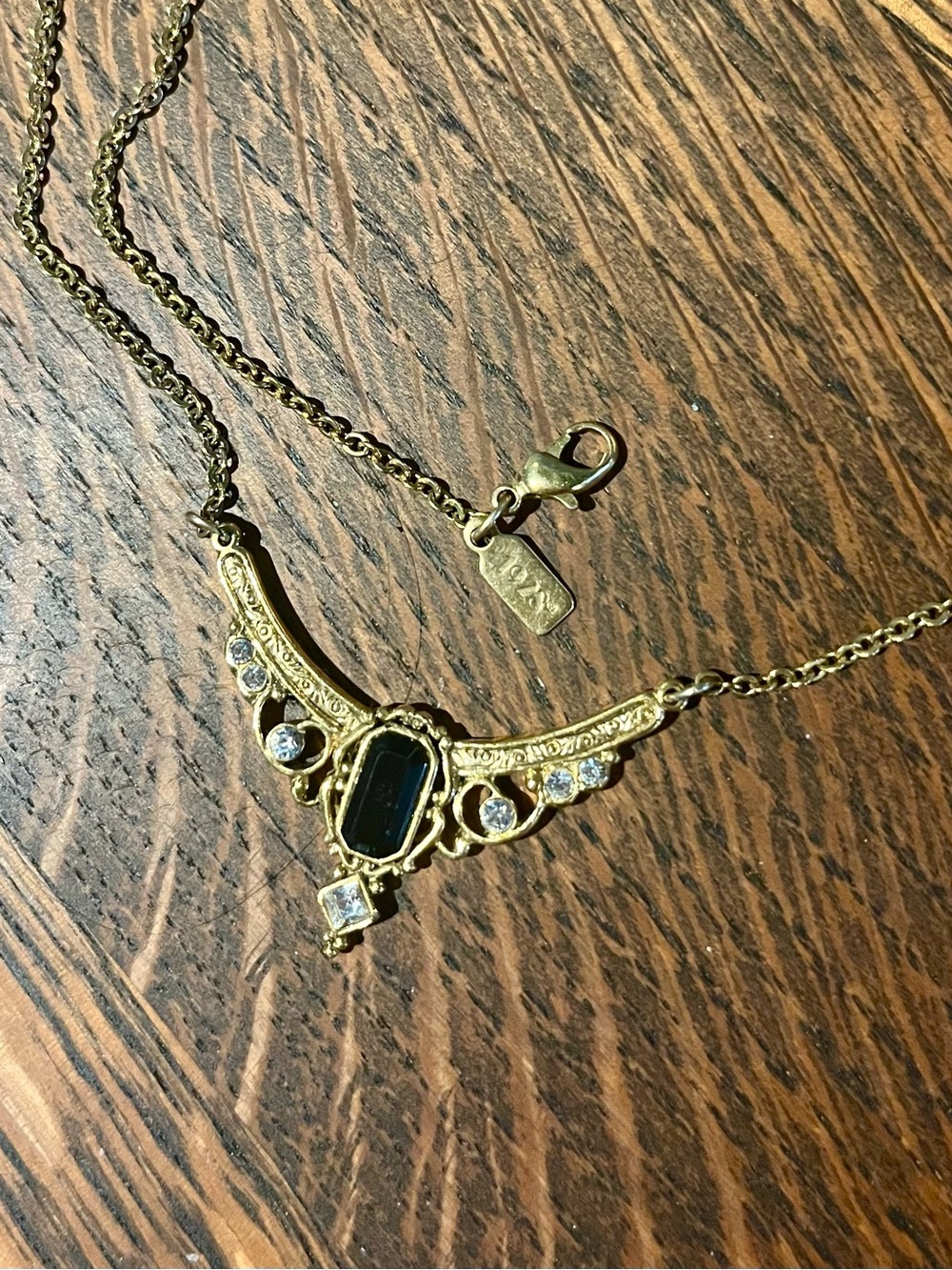 1928 Gold-Tone Black Stone Ornate Pendant Necklace